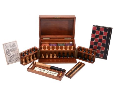  A Victorian mahogany cased games compendium,   late 19th century, the hinged cover with a folding leather playing board for 