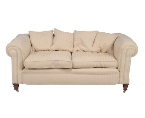  A Victorian Chesterfield style sofa  , circa 1900, with drop end, on turned mahogany legs, in herringbone striped upholstery