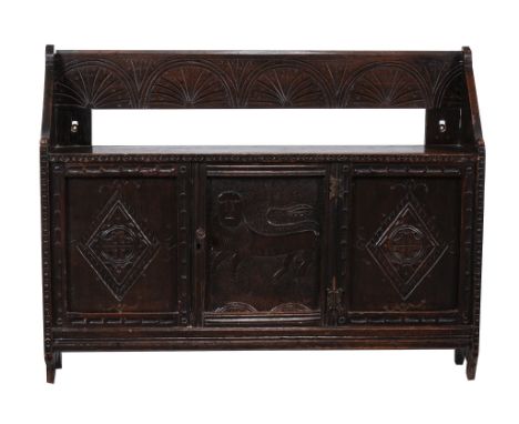  A carved oak mural cupboard in Charles II style  , constructed from 17th century and later elements, the central cupboard pa