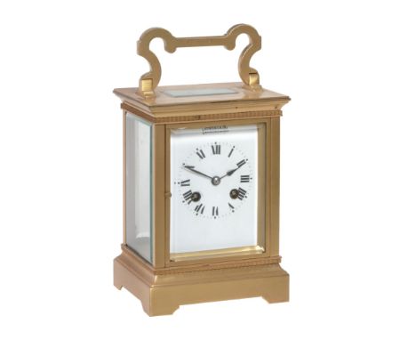 A brass mantel clock  ,   unsigned,   first quarter 20th century,  in the form of an oversized carriage clock ,   the French
