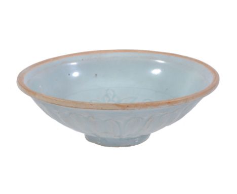  A Chinese Qingbai bowl,   possibly Song-Yuan, 12th-13th century, the centre incised with two flowers and combed details, the