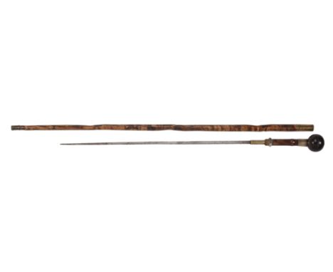  A Victorian bamboo and brass mounted sword stick,   dated 1882, the spherical hardwood grip above a collar inscribed   'LIEU