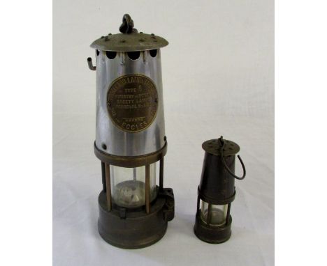 The Protector lamp & lighting co ltd Eccles miners lamp type 6 and a miniature lamp