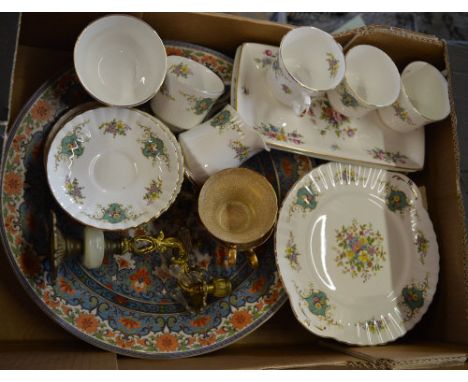 Various ceramics including plates, cups, saucers, brass effect candlestick etc