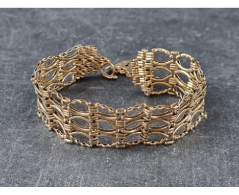A 9ct gold fancy link gate bracelet, having padlock clasp,&nbsp;16cm long, 12.9g. 