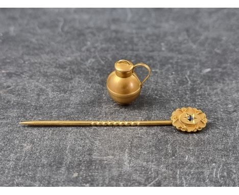 A Victorian 18ct gold Jersey jug charm, Birmingham 1898, 15mm, 1g; together with a stick pin, set small sapphire, stamped '15