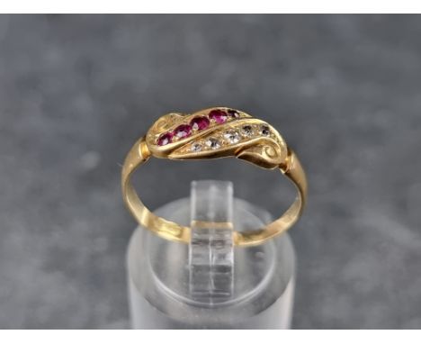 An 18ct gold ruby and diamond ring, set five diamonds and five rubies, size R, 2.6g. 