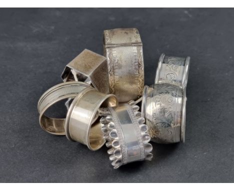 An engine turned silver bangle, by Smith &amp; Pepper Ltd, Birmingham 1947; together with eight various silver napkin rings, 