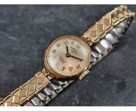 A Rotary 9ct gold manual wind ladies wristwatch, 18mm, on gold plated expanding bracelet. 