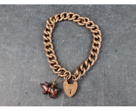A yellow metal gate bracelet, with padlock clasp, stamped '9c'. 