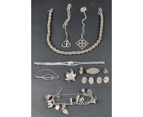A small group of silver and .925 jewellery,&nbsp;to include a pair of engine turned cufflinks; and a charm bracelet. 