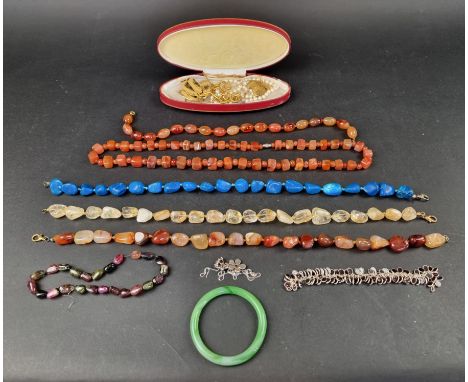 Six various stone necklaces; together with a jadeite bangle and other costume jewellery. 