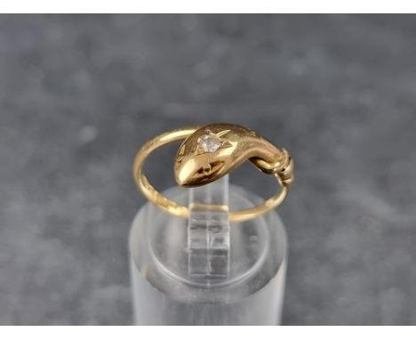 An 18ct gold diamond snake ring, set old cut stone&nbsp;of approximately 0.05ct, Chester, probably 1910, size K 1/2, gross we