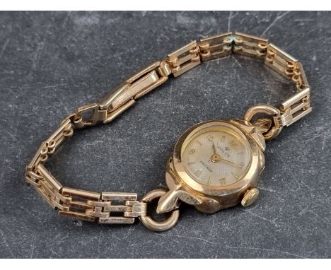 A circa 1940s/50s Rolex 'Prestige' 9ct gold manual wind ladies wristwatch, 16mm, Ref.&nbsp;299400, on gold plated bracelet. 