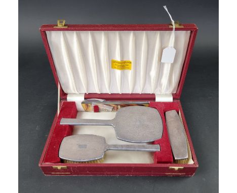A cased engine turned four piece dressing table set, by&nbsp;Deakin &amp; Francis Ltd, Birmingham 1967-70. 