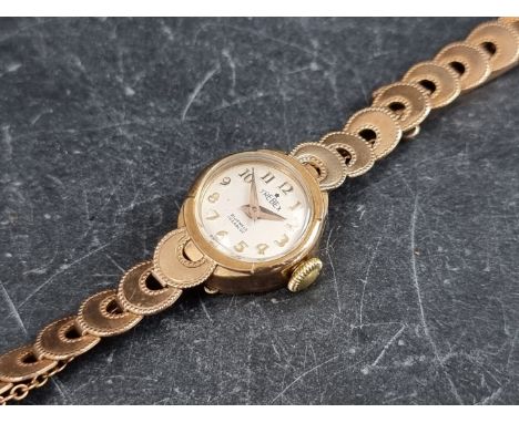A Trebex 9ct gold manual wind ladies wristwatch, 15mm, on 9ct gold bracelet. 