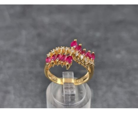 A yellow metal ruby and diamond ring, stamped&nbsp;'750', size N. 