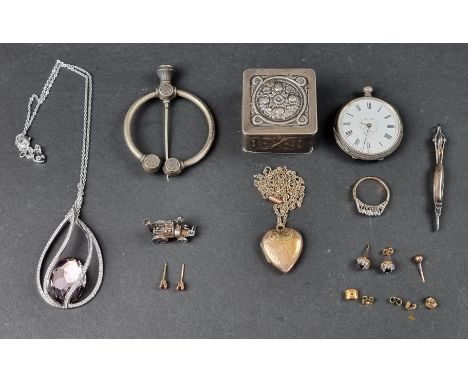 A steam engine charm, stamped 'silver'; together with a Continental .800 lidded box; and other items. 