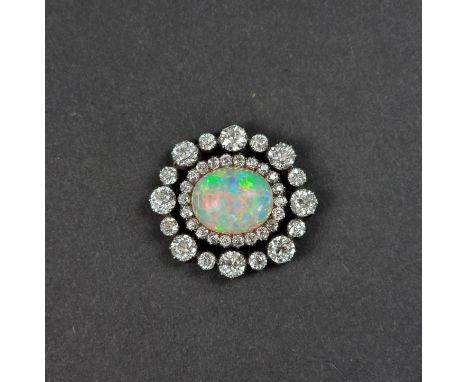 An impressive Victorian opal and diamond brooch, set central cabochon opal, estimated at 8.5ct,&nbsp;surrounded by thirty eig