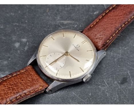 A circa 1954 Omega stainless steel manual wind wristwatch, 35mm, Ref. 14387934, Cal. 266, on later brown leather strap. 