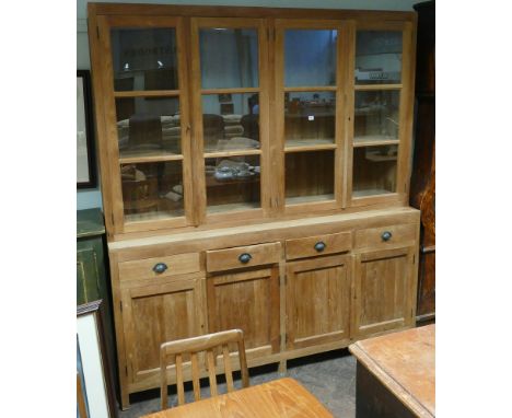 A 6'3 heavy light oak glazed bookcase with drawers and cupboards under