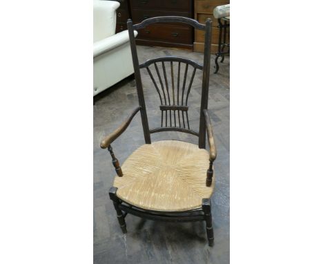 Walnut framed high stick back elbow chair with rush seat