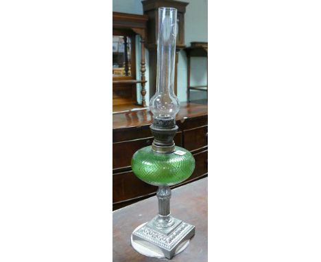 A plated Corinthian column oil lamp with green glass bowl