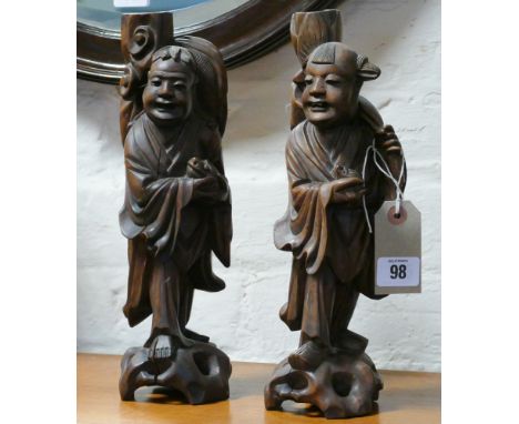 Pair of Oriental carved root wood carvings, possibly table lamp bases or candlesticks - 30cm tall 