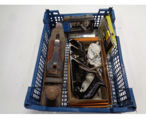 A crate containing a small quantity of tools to include Record woodworking plane, drill bits, together with a Stanley 78 plan