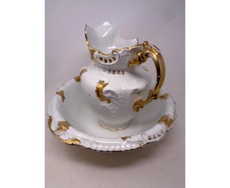 A Victorian ceramic white and gilt wash jug and basin 