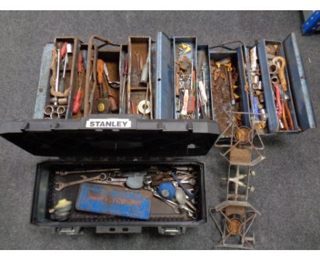 A Stanley toolbox together with two further metal concertina toolboxes containing assorted hand tools together with a two rin