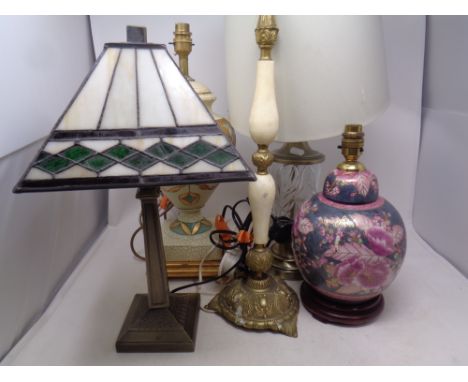 An Art Deco style table lamp with leaded glass shade, together with four further table lamps 