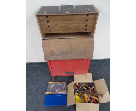 A wooden tool chest fitted three internal drawers on a metal mechanics trolley together with a small quantity of assorted han