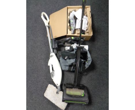 A G Tech upright vacuum together with a G Tech hand held vacuum with tools, a Dyson DC 56 hand held vacuum (as found) togethe