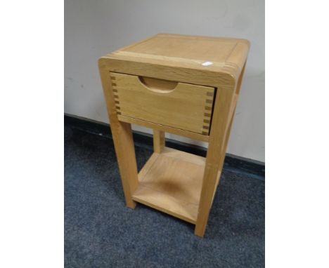 A contemporary Ercol two tier lamp table fitted a drawer, width 32 cm 