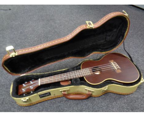 A Brunswick electro acoustic ukulele in Stagg case  