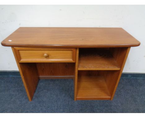 A mid 20th century teak G Plan dressing table fitted shelves and a drawer with stool, width 106 cm 