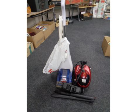 A Bissell quick wash carpet cleaner together with a Dynamo steam cleaner with accessories 