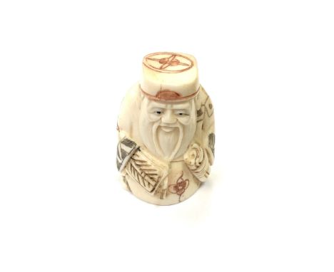 A Japanese carved bone netsuke - Village elder holding a scroll. 