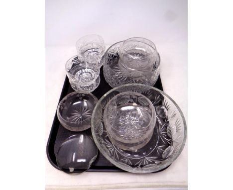 A tray containing glassware to include crystal dessert and fruit bowls, glass lens 