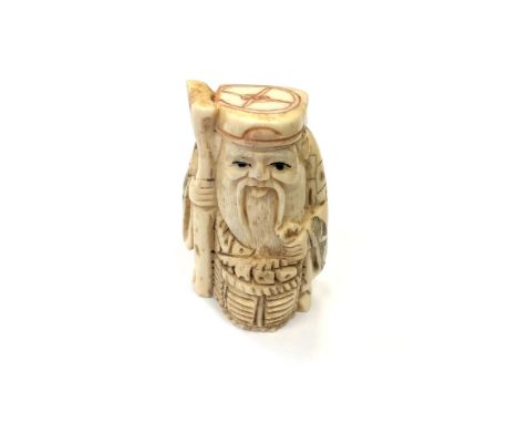 A Japanese carved bone netsuke - Village elder with a basket at his feet. 