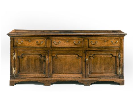 A GEORGE III OAK DRESSER BASE SECOND HALF 18TH CENTURY 83cm high, 197cm wide, 52cm deep Provenance:Barnwell Manor, Northampto