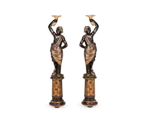 A PAIR OF CARVED AND POLYCHROME DECORATED 'BLACKAMOOR' FIGURES  19TH CENTURY, PROBABLY VENETIAN Modelled in opposing contrapp