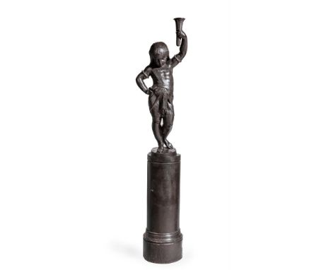A PATINATED CAST IRON FIGURE OF AN EGYPTIAN CHILD LATE 19TH CENTURY, PROBABLY FRENCH With integral pedestal base, apparently 