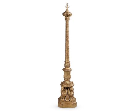 AN ORNATE CARVED GILTWOOD STANDARD LAMP IN CLASSICAL STYLE, EARLY 20TH CENTURY Foliate and overlapping leaf carved stem on wi