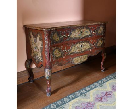 AN ITALIAN POLYCHROME PAINTED AND PARCEL GILT SERPENTINE FRONTED COMMODE LATE 18TH/EARLY 19TH CENTURY The top painted to simu