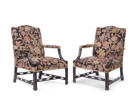 A PAIR OF CARVED BEECH AND NEEDLEWORK UPHOLSTERED GAINSBOROUGH ARMCHAIRS IN GEORGE III STYLE, PROBABLY FIRST HALF 19TH CENTUR