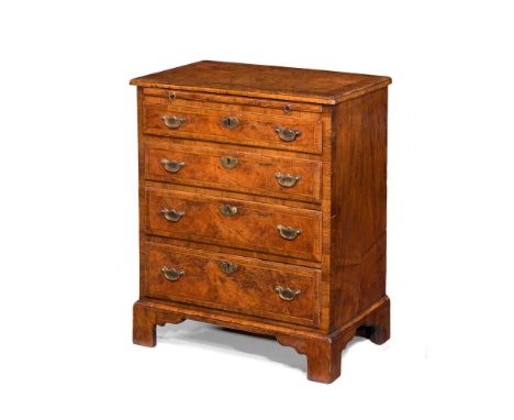 A GEORGE II WALNUT, BURR WALNUT, BURR YEW AND FEATHER BANDED BACHELOR'S CHEST OF DRAWERS CIRCA 1730Of unusual small proportio