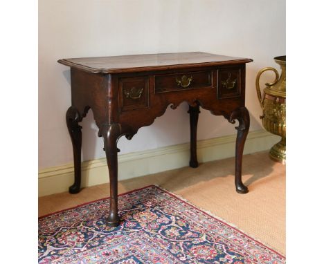 AN OAK AND CROSSBANDED SIDE TABLESECOND QUARTER 18TH CENTURY 72.5cm high, 91cm wide, 51cm deepProvenance:Barnwell Manor, Nort