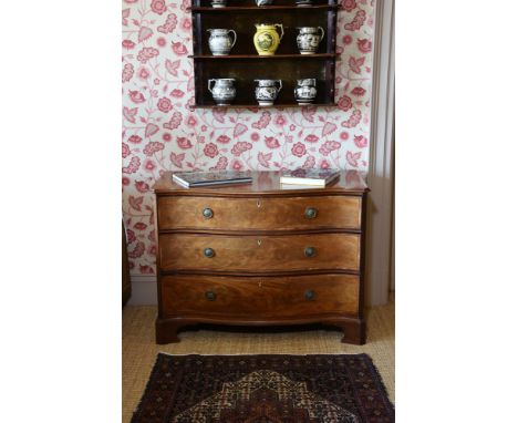 Y A GEORGE III MAHOGANY AND LINE INLAID SERPENTINE FRONTED COMMODE CIRCA 177585cm high, 114cm wide, 53cm deep Provenance:Barn